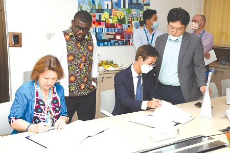 Anne-Claire Dufay (left), UNICEF Representative in Ghana and  Moonheon Kong, Country Director of KOICA signing the MoU. Picture: EBOW HANSON